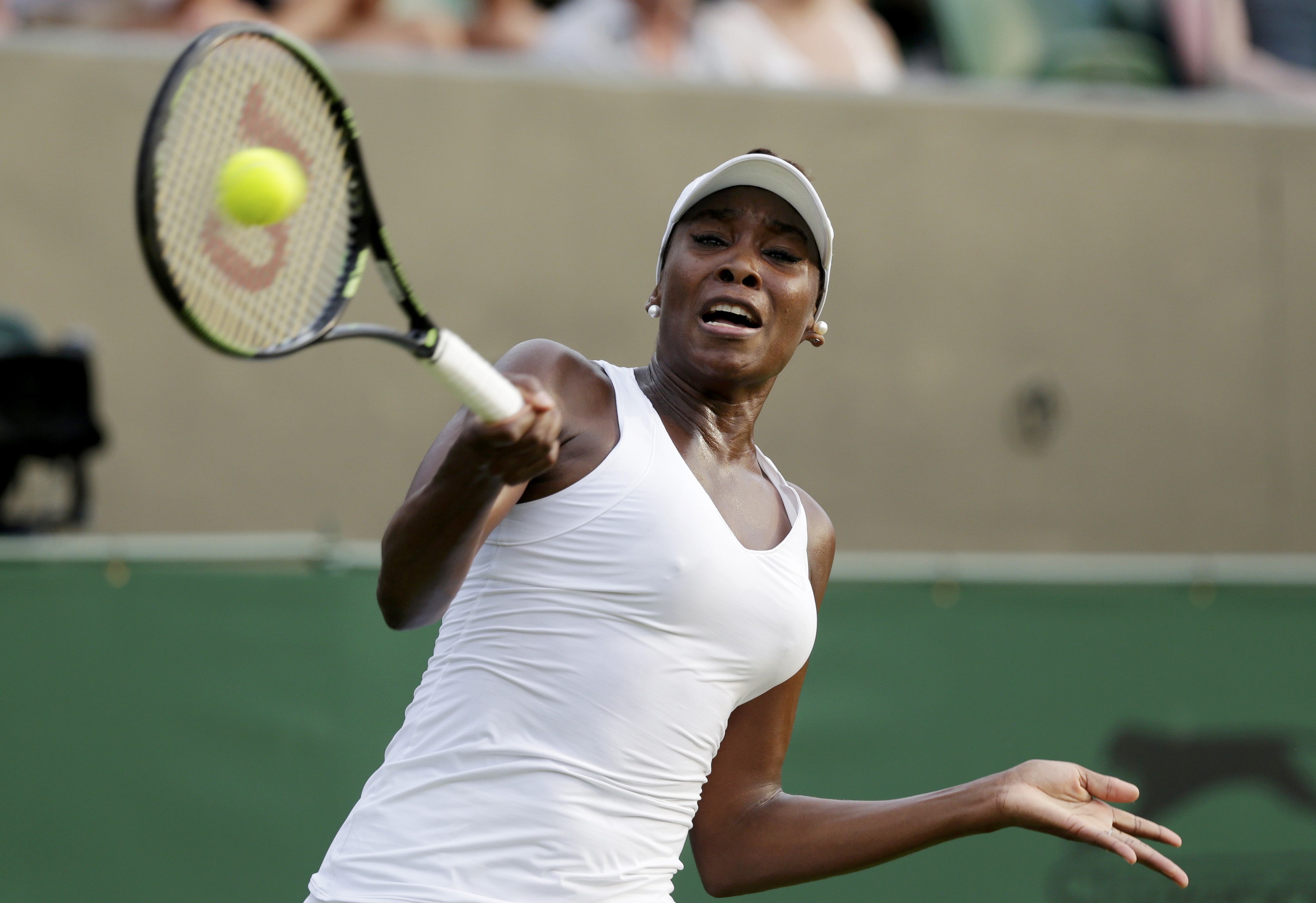 Venus Williams of the U.S.A. hits a shot during her match against Yulia Putintseva of Kazakhstan at the Wimbledon Tennis Championships in London, July 1, 2015. REUTERS/Henry Browne