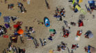 An aerial view shows people at a beach on the shores of the Silbersee lake on a hot summer day in Haltern, Germany, July 4, 2