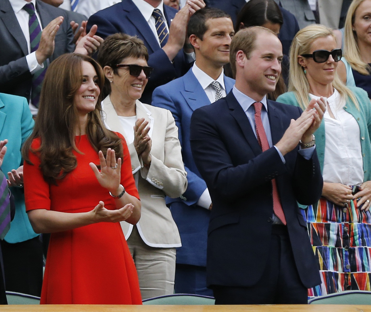 Britain's Catherine Duchess of Cambridge and Prince William (R) applaud after Andy Murray of Britain won his match against Vasek Pospisil of Canada at the Wimbledon Tennis Championships in London, July 8, 2015. REUTERS/Suzanne Plunkett
