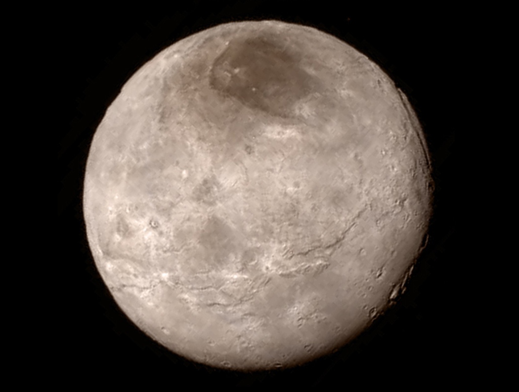 New details of Pluto�s largest moon Charon are revealed in this image from New Horizons� Long Range Reconnaissance Imager (LORRI), taken late on July 13, 2015 from a distance of 289,000 miles (466,000 kilometers) in a picture released by NASA in Laurel, Maryland July 15, 2015. A U.S. spacecraft sailed past the tiny planet Pluto in the distant reaches of the solar system on Tuesday, capping a journey of 3 billion miles (4.88 billion km) that began nine and a half years ago. NASA's New Horizons spacecraft passed by the ice-and-rock planetoid and its entourage of five moons at 7:49 a.m. EDT (1149 GMT). The event culminated an initiative to survey the solar system that the space agency embarked upon more than 50 years ago. REUTERS/NASA New Horizons/Handout via Reuters TPX IMAGES OF THE DAY. THIS IMAGE HAS BEEN SUPPLIED BY A THIRD PARTY. IT IS DISTRIBUTED, EXACTLY AS RECEIVED BY REUTERS, AS A SERVICE TO CLIENTS. FOR EDITORIAL USE ONLY. NOT FOR SALE FOR MARKETING OR ADVERTISING CAMPAIGNS