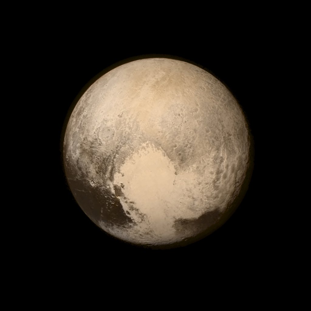 Pluto nearly fills the frame in this image from the Long Range Reconnaissance Imager (LORRI) aboard NASA's New Horizons spacecraft, taken on July 13, 2015, when the spacecraft was 476,000 miles (768,000 kilometers) from the surface and released on July 14, 2015. More than nine years after its launch, the U.S. spacecraft sailed past Pluto on Tuesday, capping a 3 billion mile (4.88 billion km) journey to the solar system’s farthest reaches, NASA said. This is the last and most detailed image sent to Earth before the spacecraft's closest approach to Pluto on July 14. The color image has been combined with lower-resolution color information from the Ralph instrument that was acquired earlier on July 13. This view is dominated by the large, bright feature informally named the 