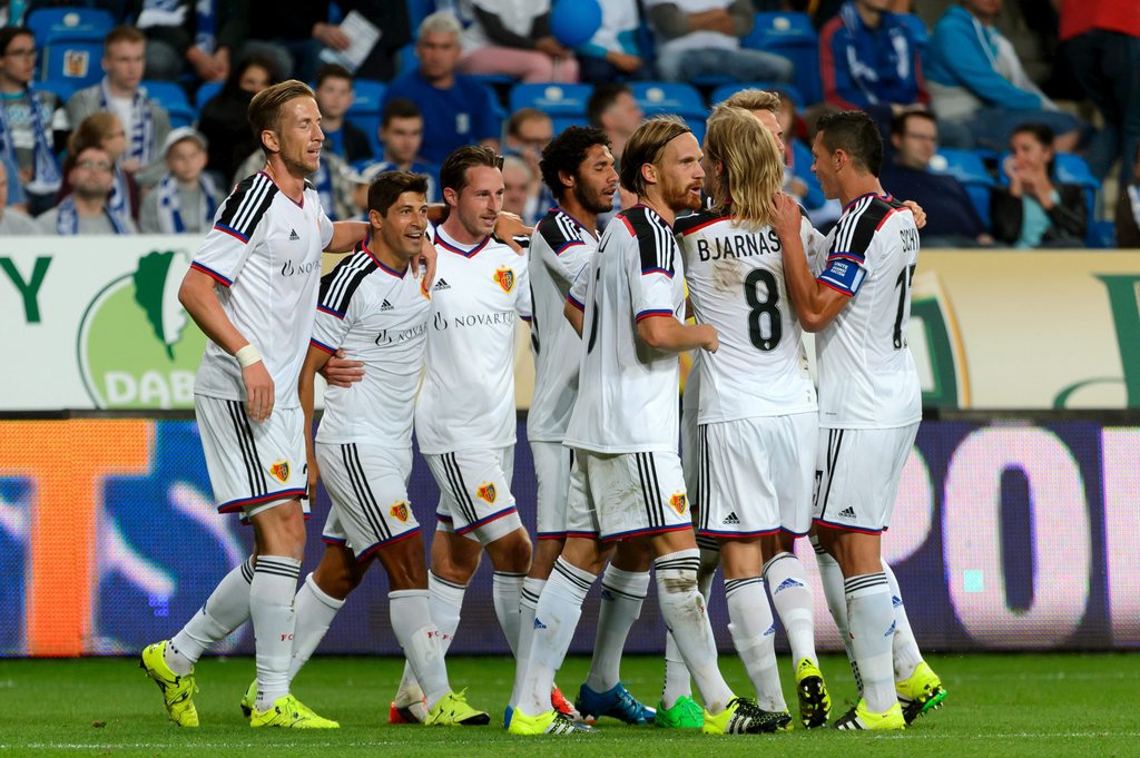 epa04865548 Davide Calla (2-L) of FC Basel celebrates with team mates after scoring a goal during the UEFA Champions League third qualifying round first leg soccer match between Lech Poznan and FC Basel in Poznan, Poland, 29 July 2015. EPA/Jakub Kaczmarczyk POLAND OUT