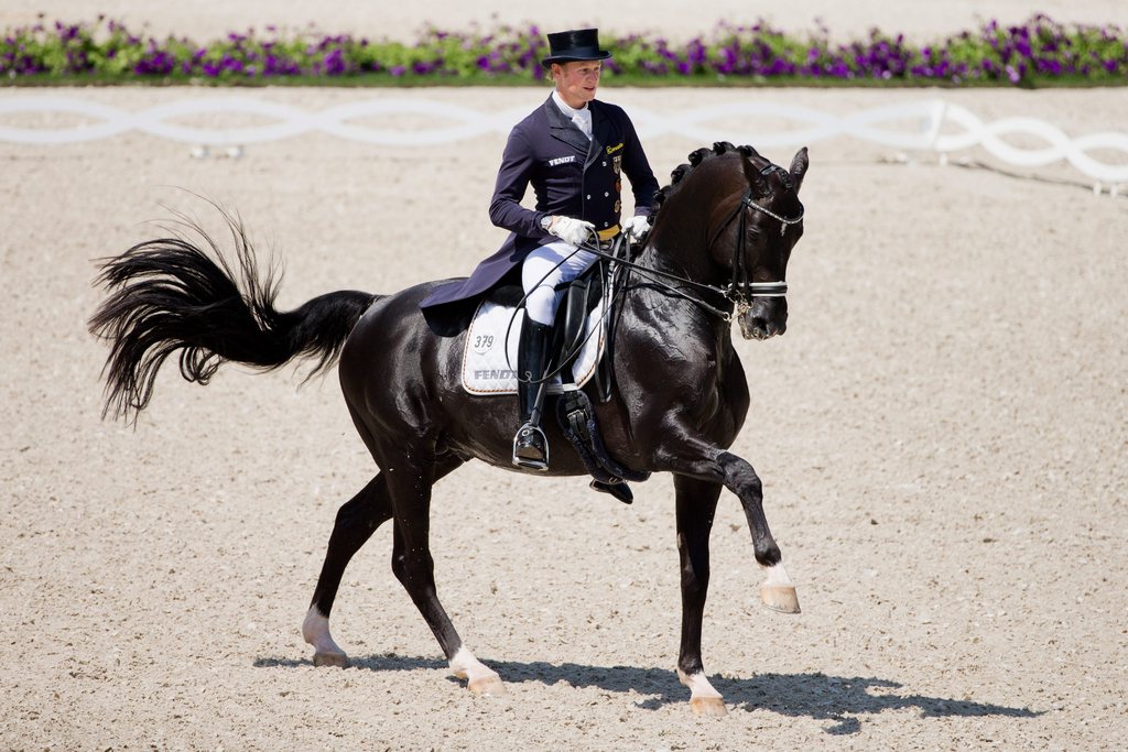 epa04319920 German rider Matthias Alexander Rath on his horse Totilas during the CHIO horse show in Aachen, Germany, 17 July 2014. EPA/ROLF VENNENBERND