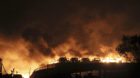 Vehicles are seen burning after blasts at Binhai new district in Tianjin municipality, China, August 13, 2015. Huge explosion