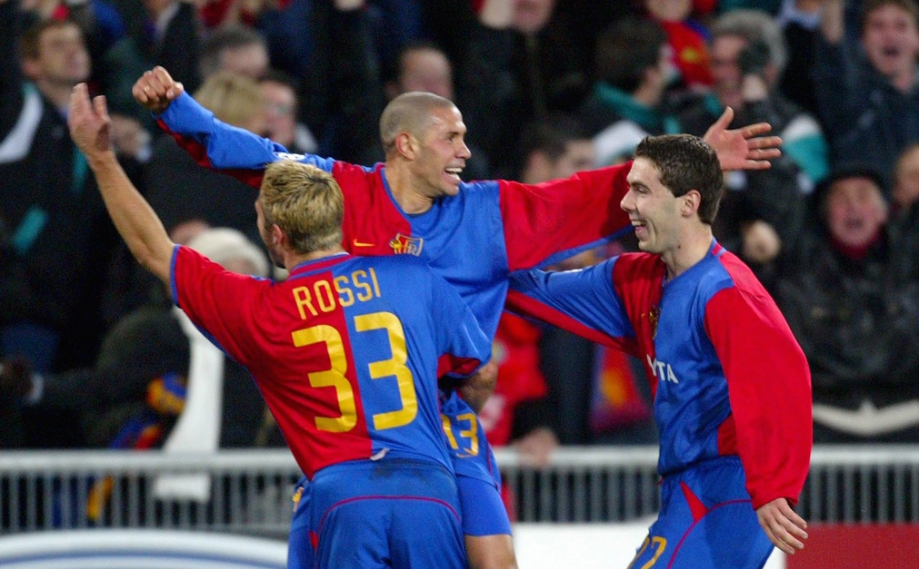 Basel's Christian Gimenez (C) celebrates his goal with teammates Julio Rossi (L), who scored the first goal, and Ivan Ergic (R) during the Champions League, Group B, soccer game Basel vs Liverpool in Basel, Switzerland, Tuesday 12 November 2002. (KEYSTONE/ Fabrice Coffrini)