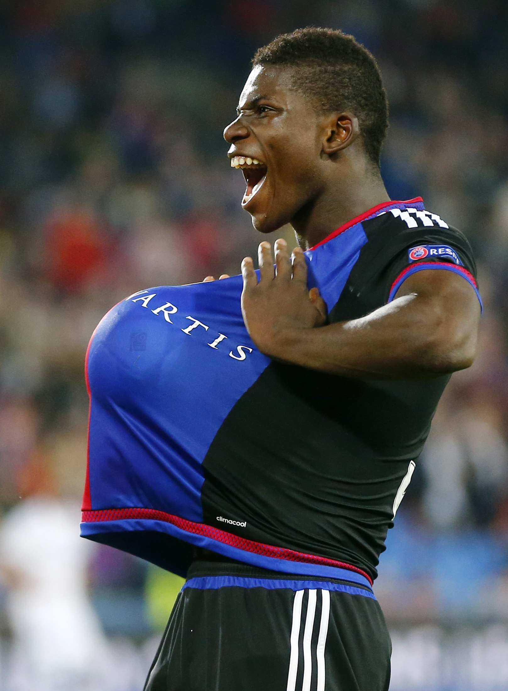 FC Basel's Breel Embolo reacts after scoring the second goal against Maccabi Tel Aviv during their Champions League play-off first leg soccer match at the St. Jakob Park stadium in Basel August 19, 2015. REUTERS/Arnd Wiegmann