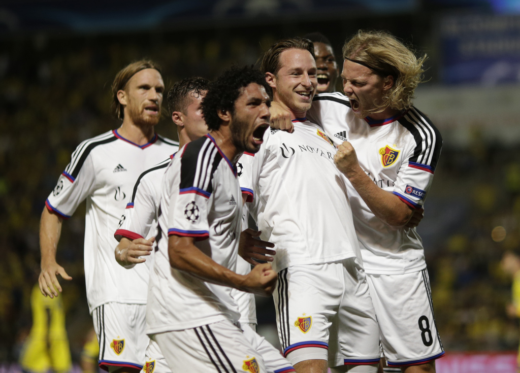 FC Basel players celebrate scoring a first goal during the UEFA Champions League play-off round second leg soccer match between Switzerland's FC Basel and Israel's Maccabi Tel Aviv FC in Bloomfield stadium in Tel Aviv, Israel, Tuesday, Aug. 25, 2015 . (AP Photo/Ariel Schalit)