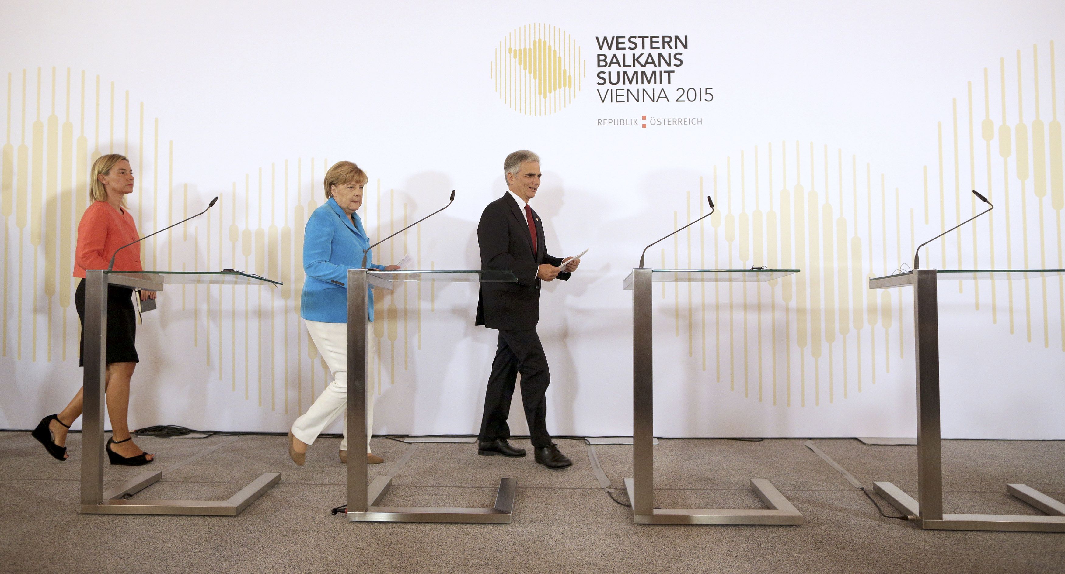 Austrian Chancellor Werner Faymann, German Chancellor Angela Merkel, and European Union Foreign Policy Chief Federica Mogherini arrive for a news conference during the Western Balkans Summit in Vienna August 27, 2015. REUTERS/Lisi Niesner