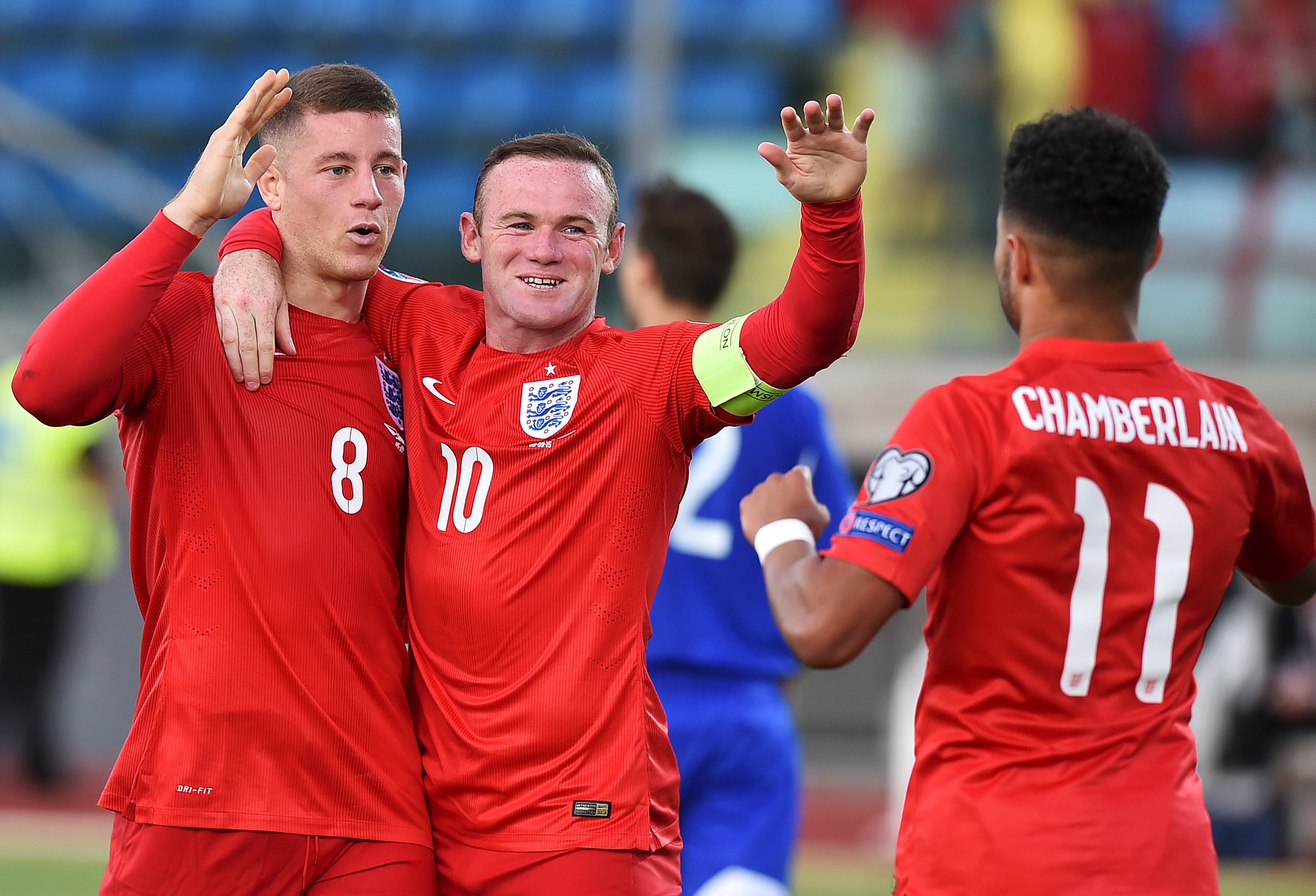 England's Ross Barkley (L) celebrates after scoring a goal with team mates Wayne Rooney (C) and Alex Oxlade-Chamberlain during their Euro 2016 qualifying soccer match against San Marino at the Olympic stadium in Serravalle, San Marino, September 5, 2015. REUTERS/Alberto Lingria