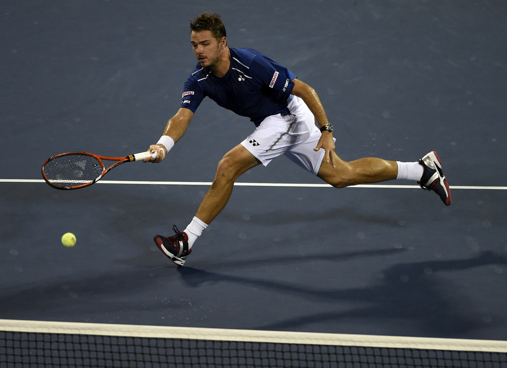 Stan Wawrinka, of Switzerland, returns a shot to Kevin Anderson, of South Africa, during a quarterfinal match at the U.S. Open tennis tournament, Wednesday, Sept. 9, 2015, in New York. (AP Photo/Kathy Kmonicek)