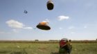 Migrants' tents are blown off by the wind near a collection point in the village of Roszke, Hungary September 9, 2015. Hungar