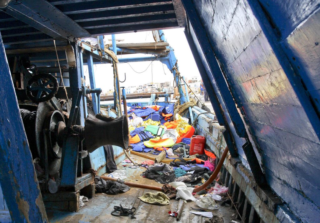 <p>epa03894051 Migrants' belongings are strewn across the deck of a ship at Lampedusa Island, Italy, 03 October 2013. According to Italian port authorities, at least 93 bodies have been recovered off the Italian coast after a ship carrying migrants sank near the southern island of Lampedusa. The ship, which was believed to be carrying hundreds of migrants from Somalia and Eritrea, suffered extensive damage as it approached the smaller island of Conigli. Italian officials said another ship carrying 463 migrants had arrived in Lampedusa overnight. EPA/CLAUDIO PERI</p>