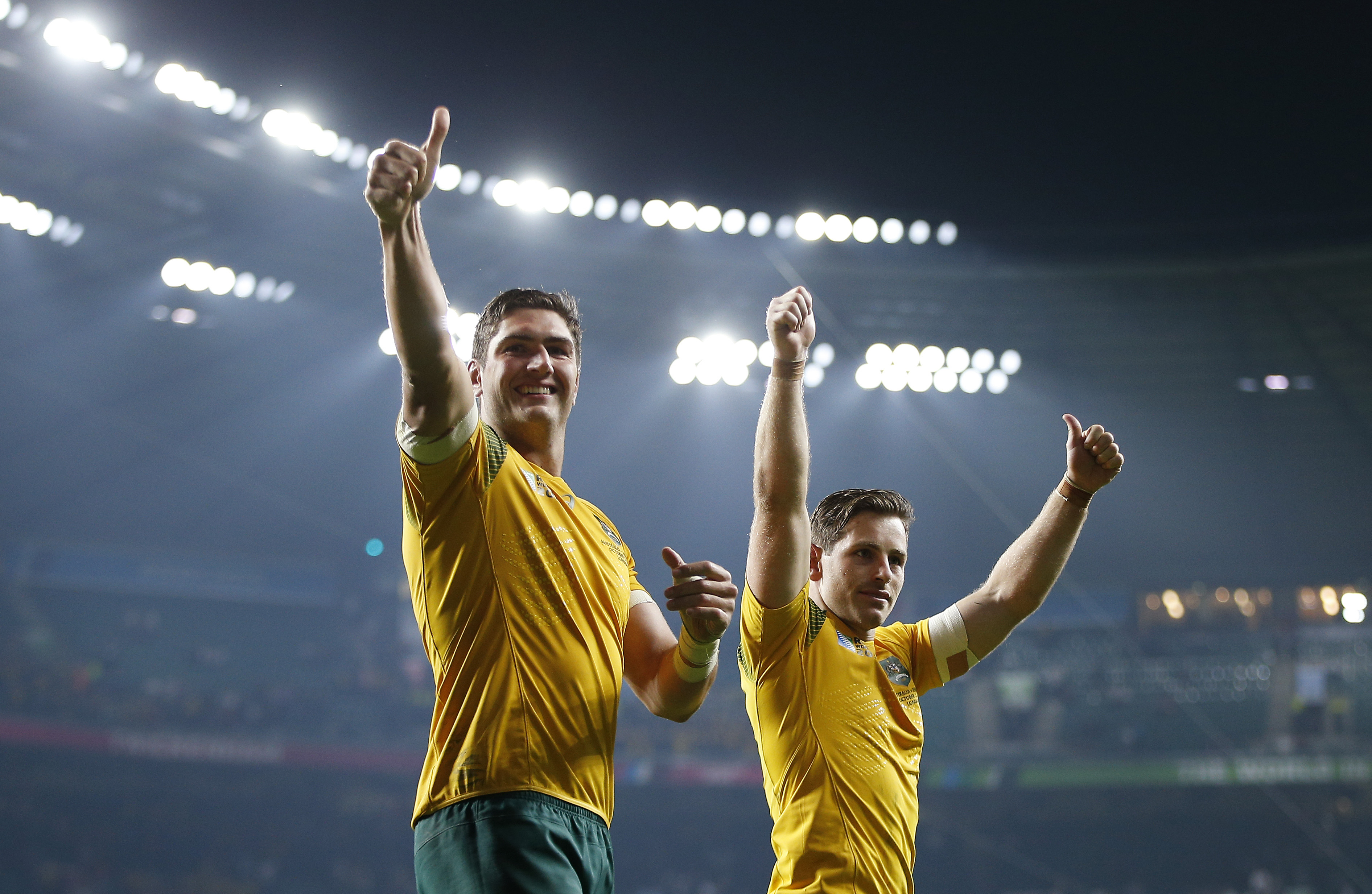 Rugby Union - England v Australia - IRB Rugby World Cup 2015 Pool A - Twickenham Stadium, London, England - 3/10/15 Australia's Bernard Foley (R) and Rob Simmons celebrate victory at the end of the match Action Images via Reuters / Andrew Couldridge Livepic