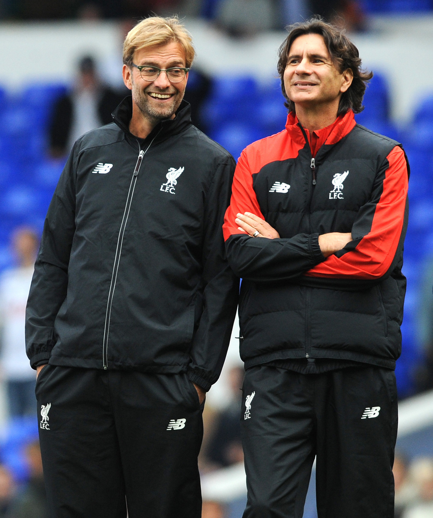 Liverpool manager Juergen Klopp, left, smiles with assistant manager Zeljko Buvac before the English Premier League soccer match between Tottenham Hotspur and Liverpool at the White Hart Lane, London, England, Saturday, Oct. 17, 2015. (AP Photo/Rui Vieira)