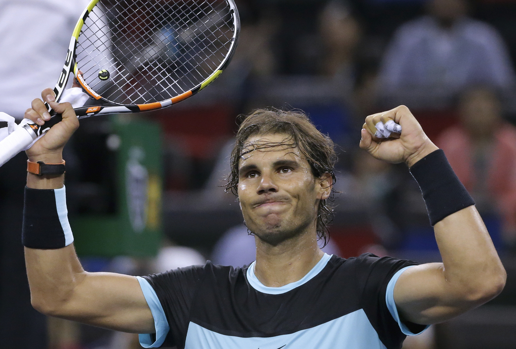 Rafael Nadal of Spain celebrates after defeating Stan Wawrinka of Switzerland in the quarterfinal match of the Shanghai Masters tennis tournament in Shanghai, China, Friday, Oct. 16, 2015. (AP Photo/Andy Wong)