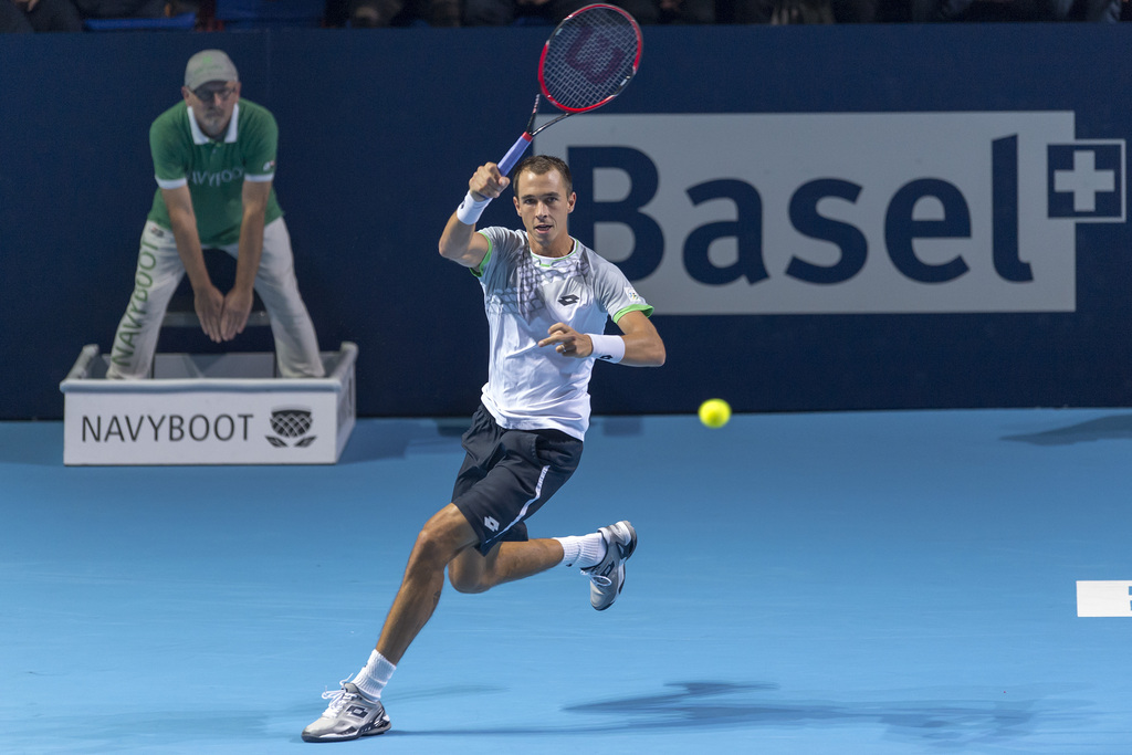 Czech Republic's Lukas Rosol returns a ball to Spain's Rafael Nadal during their first round match at the Swiss Indoors tennis tournament at the St. Jakobshalle in Basel, Switzerland, on Monday, October 26, 2015. (KEYSTONE/Georgios Kefalas)
