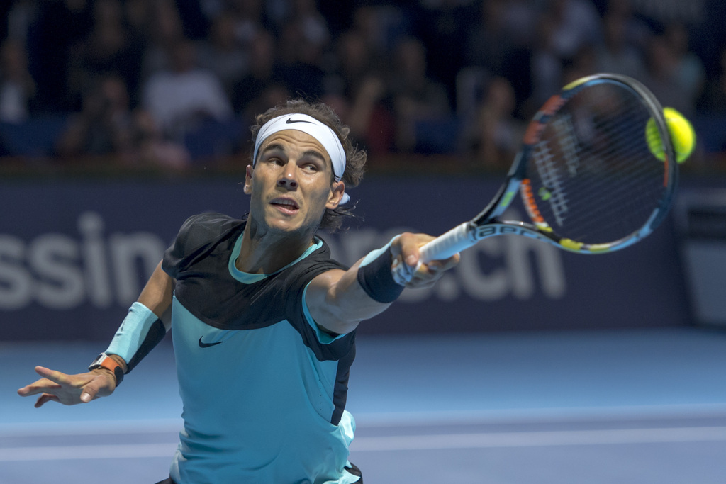 Spain's Rafael Nadal returns a ball to Czech Republic's Lukas Rosol during their first round match at the Swiss Indoors tennis tournament at the St. Jakobshalle in Basel, Switzerland, on Monday, October 26, 2015. (KEYSTONE/Georgios Kefalas)