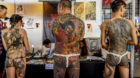 Contestants of a tattoo competition pose for photographs at the China TATTOO convention in Nanning, Guangxi Zhuang Autonomous