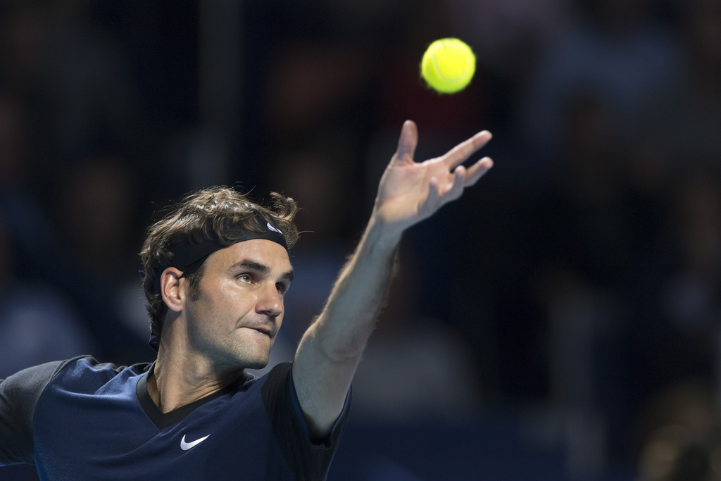 Switzerland's Roger Federer serves a ball to Germany's Philipp Kohlschreiber during their round of sixteen match at the Swiss Indoors tennis tournament at the St. Jakobshalle in Basel, Switzerland, on Thursday, October 29, 2015. (KEYSTONE/Georgios Kefalas)