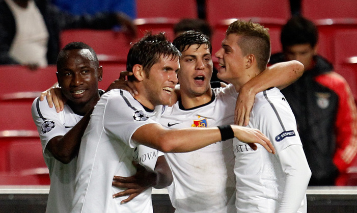 Basel's Benjamin Huggel, 2nd left, celebrates after scoring their first goal against Benfica during their Champions League group C soccer match Wednesday, Nov. 2 2011, at Benfica's Luz stadium in Lisbon. (AP Photo/Armando Franca)