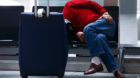 A stranded passenger sleeps in Frankfurt airport, Germany, November 6, 2015. German airline Lufthansa cancelled hundreds of f