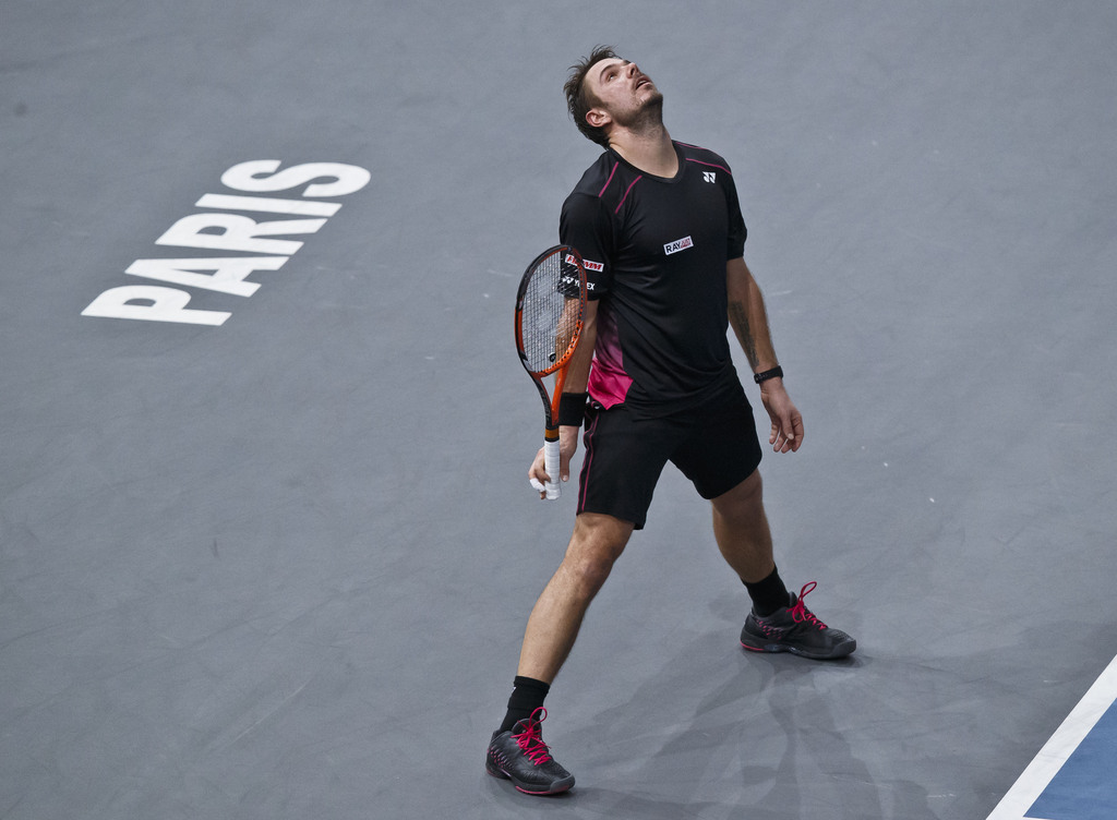 Stanilas Wawrinka of Switzerland reacts after losing a point against Novak Djokovic of Serbia during their semifinal match of the BNP Masters tennis tournament at the Paris Bercy Arena, in Paris, France, Saturday, Nov. 7, 2015. (AP Photo/Michel Euler)