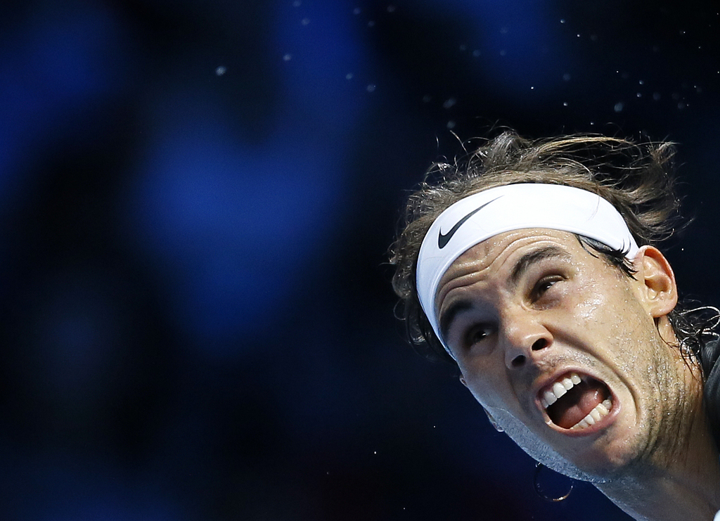 Rafael Nadal of Spain serves to Andy Murray of Britain during their singles tennis match at the ATP World Tour Finals at the O2 Arena in London, Wednesday, Nov. 18, 2015. (AP Photo/Kirsty Wigglesworth)