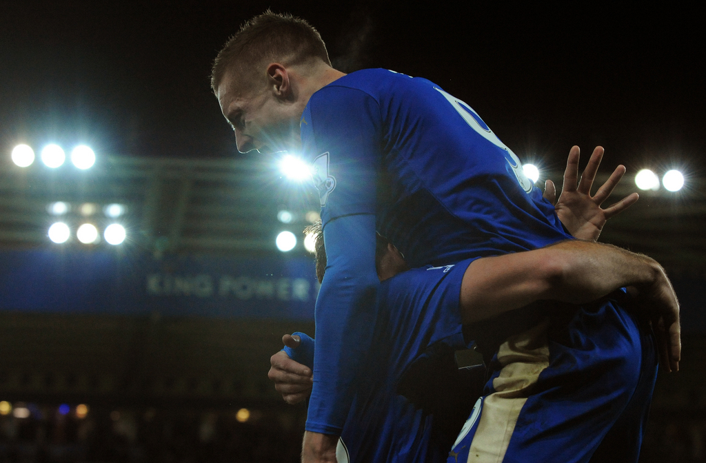 Leicester�s Jamie Vardy, top, celebrates after scoring his eleventh consecutive goal of the season against Manchester United during the English Premier League soccer match between Leicester City and Manchester United at the King Power Stadium, Leicester, England, Saturday, Nov. 28, 2015. Vardy becomes the first man to score in 11 consecutive English Premier League soccer matches after finding the back of the net against Manchester United today. (AP Photo/Rui Vieira)
