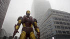 A statue of the Iron Man is seen between the buildings at Yujiapu Financial District amid heavy smog in Tianjin, China, Decem