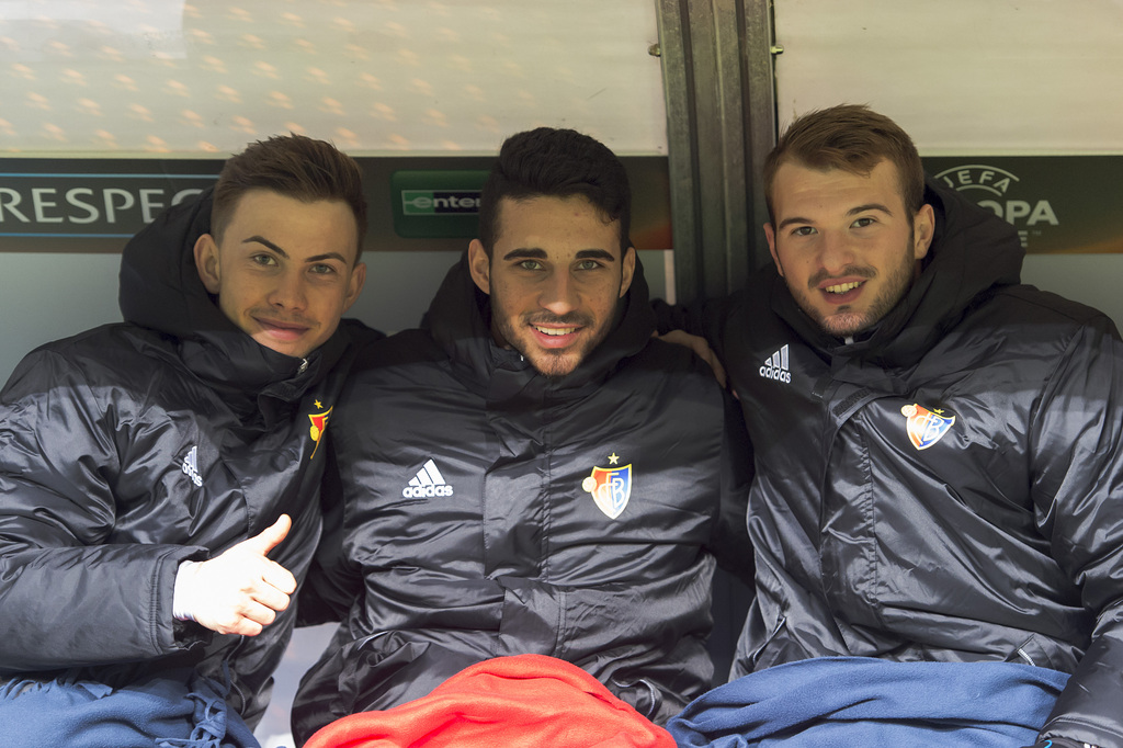 Basel's Robin Marc Huser, Eray Cuemart and Adonis Ajeti, from left, on the substitution bench during the UEFA Europa League group I group stage matchday 6 soccer match between Poland's KKS Lech Poznan and Switzerland's FC Basel 1893 at the Inea Stadium in Poznan, Poland, on Thursday, December 10, 2015. (KEYSTONE/Georgios Kefalas)