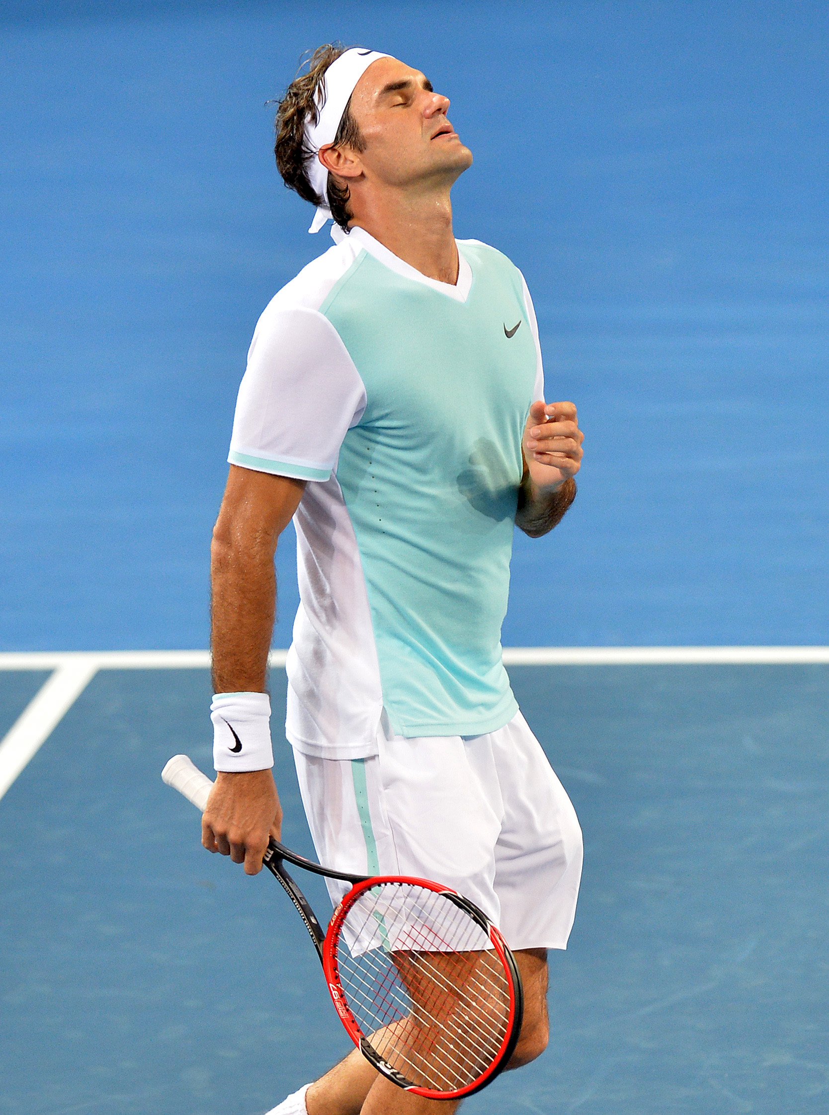 Roger Federer of Switzerland reacts during his men's singles final loss to Milos Raonic of Canada at the Brisbane International Tennis Tournament in Brisbane, Australia, January 10, 2016. REUTERS/Bradley Kanaris/AAP ATTENTION EDITORS - THIS PICTURE WAS PROVIDED BY A THIRD PARTY. IT IS DISTRIBUTED EXACTLY AS RECEIVED BY REUTERS, AS A SERVICE TO CLIENTS. EDITORIAL USE ONLY. NOT FOR SALE FOR MARKETING OR ADVERTISING CAMPAIGNS. NO RESALES. NO ARCHIVE. AUSTRALIA OUT. NO COMMERCIAL OR EDITORIAL SALES IN AUSTRALIA. NEW ZEALAND OUT. NO COMMERCIAL OR EDITORIAL SALES IN NEW ZEALAND.