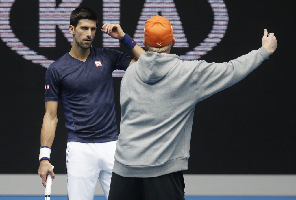 Serbia's Novak Djokovic listens to his coach Boris Becker, right, during a practice session ahead of the Australian Open tennis championships in Melbourne, Australia, Friday, Jan. 15, 2016.(AP Photo/Mark Baker)