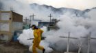 A health worker carries out fumigation as part of preventive measures against the Zika virus and other mosquito-borne disease