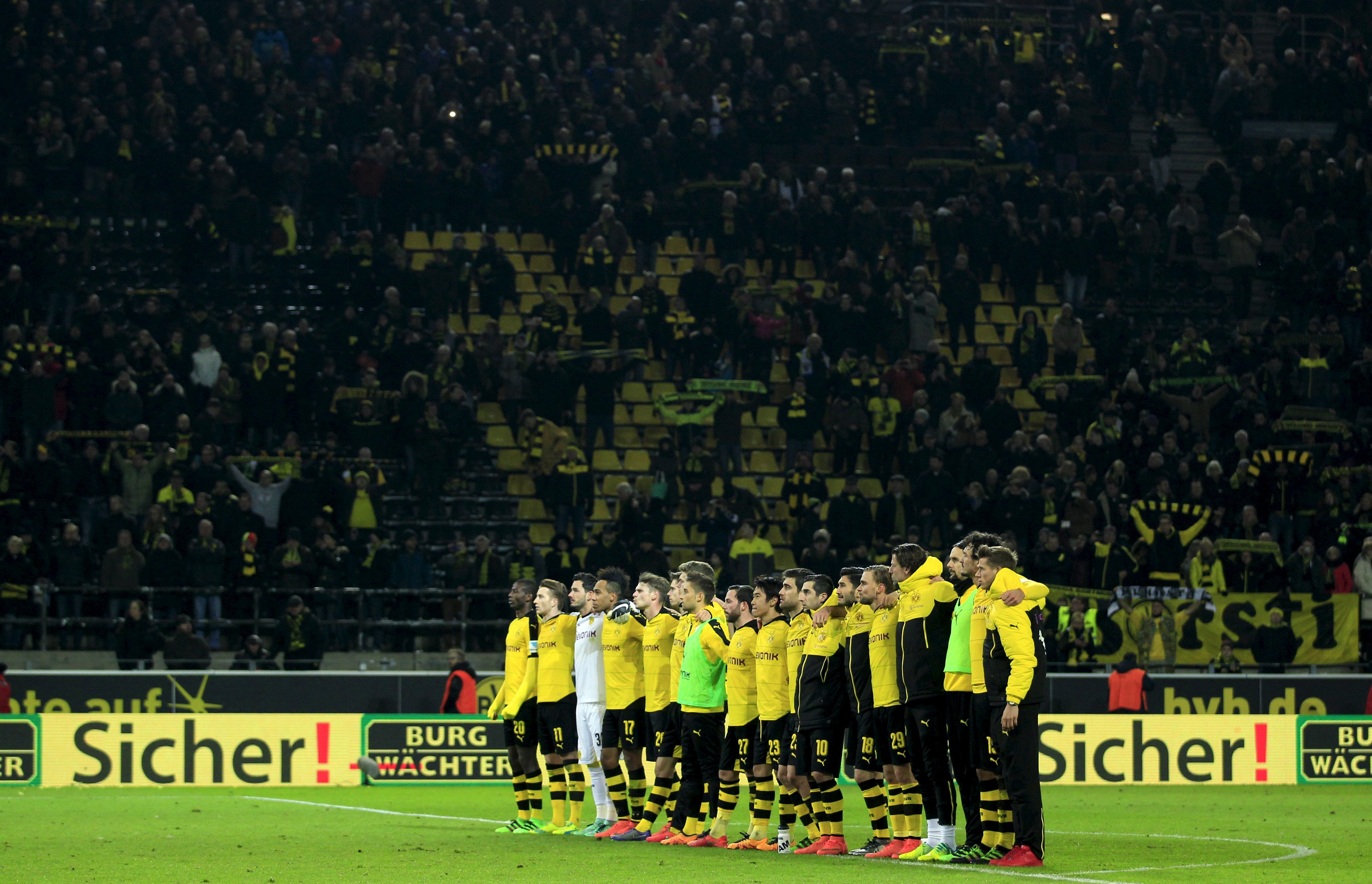 Football Soccer - Borussia Dortmund v FSV Mainz 05 - German Bundesliga - Signal Iduna Park , Dortmund, 13/03/16 The team of Borussia Dortmund commemorates a supporter, who died during the match in the stadium DFL RULES TO LIMIT THE ONLINE USAGE DURING MATCH TIME TO 15 PICTURES PER GAME. IMAGE SEQUENCES TO SIMULATE VIDEO IS NOT ALLOWED AT ANY TIME. FOR FURTHER QUERIES PLEASE CONTACT DFL DIRECTLY AT + 49 69 650050