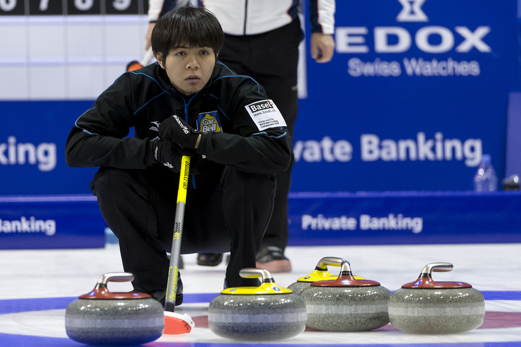Japan's skip Yusuke Morozumi observes the gliding of a stone during a round robin match between Japan and Russia at the world men's curling championship 2016 in the St. Jakobshalle in Basel, Switzerland, on Thursday, April 7, 2016. (KEYSTONE/ Georgios Kefalas)