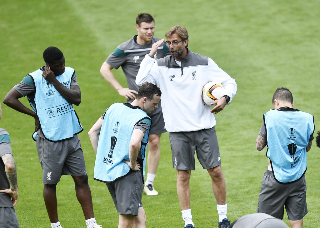 Liverpool's coach Juergen Klopp talks to his players during the last training session prior the Europa League final between Liverpool FC and Sevilla FC in Basel, Switzerland, Tuesday, May 17, 2016. (AP Photo/Martin Meissner)