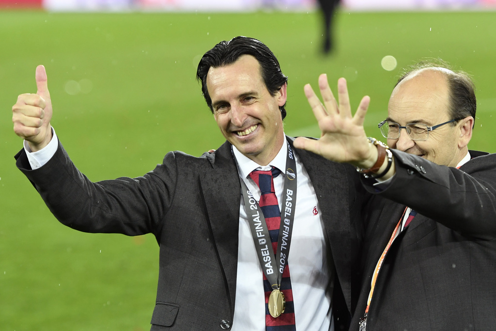 Sevilla's head coach Unai Emery, left, celebrates with the club's president Jose Castro after the final whistle of the soccer Europa League final between England's Liverpool FC and Spain's Sevilla Futbol Club at the St. Jakob-Park stadium in Basel, Switzerland, on Wednesday, May 18, 2016. (Laurent Gillieron/Keystone via AP)