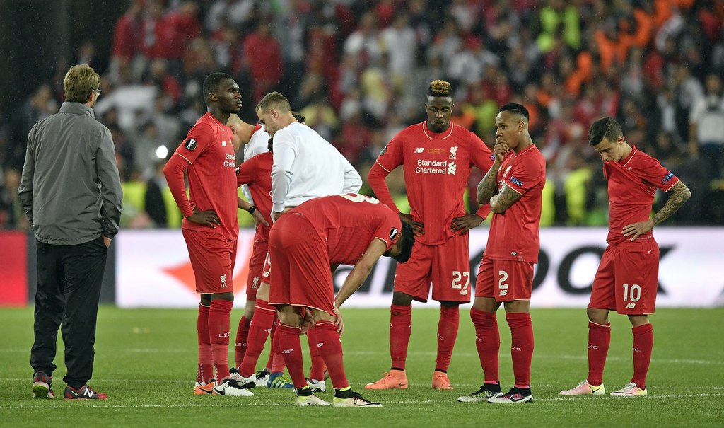 Liverpool players react after the Europa League final soccer match between Liverpool and Sevilla in Basel, Switzerland, Wednesday, May 18, 2016. Sevilla won the match 3-0. (AP Photo/Martin Meissner)