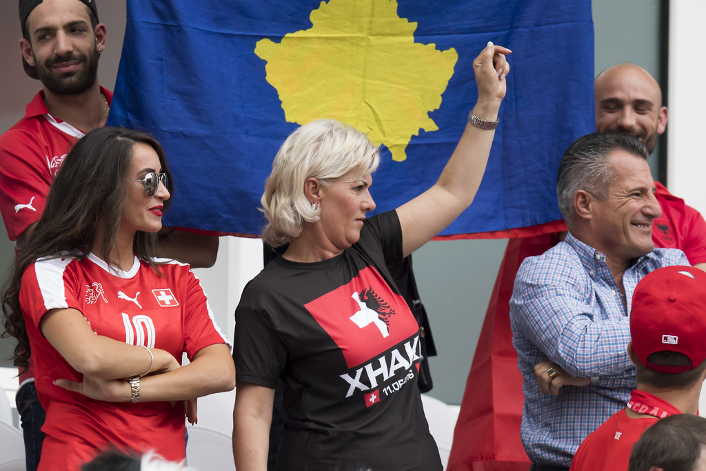 Leonita, left, the girlfriend of Swiss midfielder Granit Xhaka, cheers with the mother and the father of the soccer player during the UEFA EURO 2016 group A preliminary round soccer match between Albania and Switzerland, at the Stadium Bollaert-Delelis, in Lens, France, Saturday, June 11, 2016. (KEYSTONE/Jean-Christophe Bott)