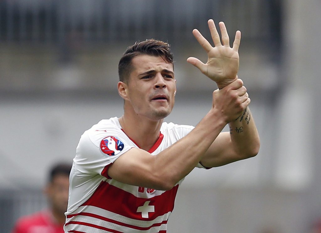 epa05357015 Granit Xhaka of Switzerland reacts during the UEFA EURO 2016 group A preliminary round match between Albania and Switzerland at Stade Bollaert-Delelis in Lens Agglomeration, France, 11 June 2016.....(RESTRICTIONS APPLY: For editorial news reporting purposes only. Not used for commercial or marketing purposes without prior written approval of UEFA. Images must appear as still images and must not emulate match action video footage. Photographs published in online publications (whether via the Internet or otherwise) shall have an interval of at least 20 seconds between the posting.) EPA/LAURENT DUBRULE EDITORIAL USE ONLY