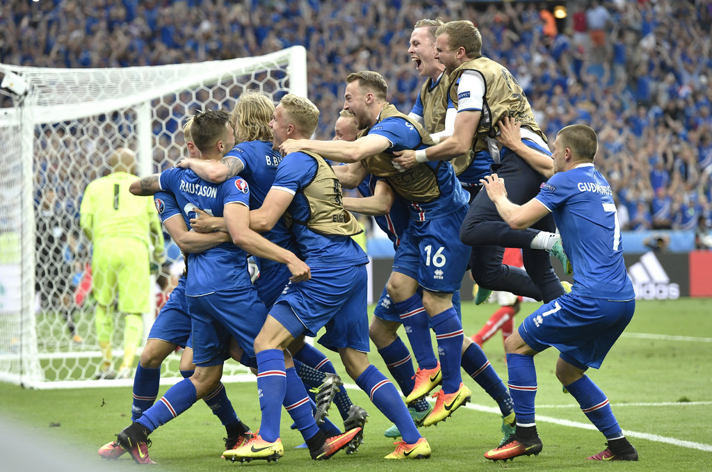 Iceland players celebrate a goal by Iceland's Arnor Ingvi Traustason during the Euro 2016 Group F soccer match between Iceland and Austria at the Stade de France in Saint-Denis, north of Paris, France, Wednesday, June 22, 2016. (AP Photo/Martin Meissner)