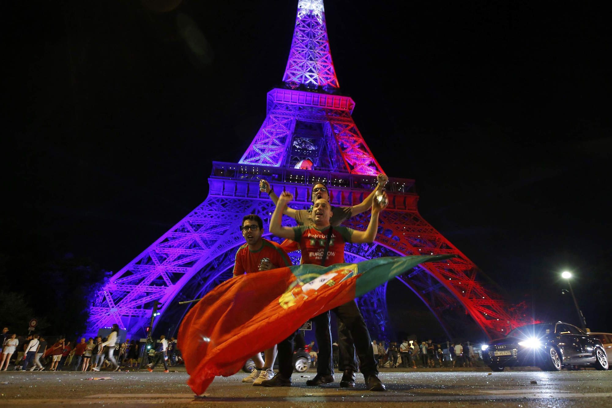 Portugal fans react near the Eiffel Tower after their team won in the Portugal v France EURO 2016 final soccer match in Paris, France, July 11, 2016. REUTERS/Stephane Mahe