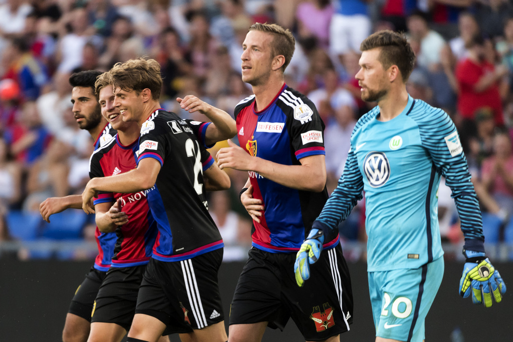 Basel's players cheer after scoring during a friendly soccer match between Switzerland's FC Basel 1893 and Germany's VfL Wolfsburg at the St. Jakob-Park stadium in Basel, Switzerland, on Tuesday, July 19, 2016. (KEYSTONE/Georgios Kefalas)