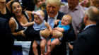 Republican presidential nominee Donald Trump holds babies at a campaign rally in Colorado Springs, Colorado, U.S., July 29, 2