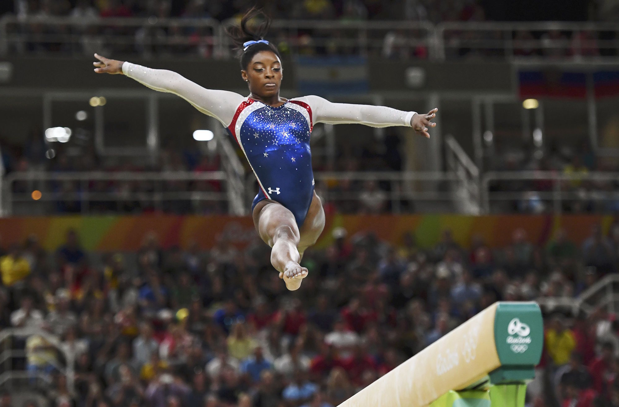 2016 Rio Olympics - Artistic Gymnastics - Final - Women's Individual All-Around Final - Rio Olympic Arena - Rio de Janeiro, Brazil - 11/08/2016. Simone Biles (USA) of USA competes on the beam during the women's individual all-around final. dy REUTERS/Dylan Martinez FOR EDITORIAL USE ONLY. NOT FOR SALE FOR MARKETING OR ADVERTISING CAMPAIGNS.