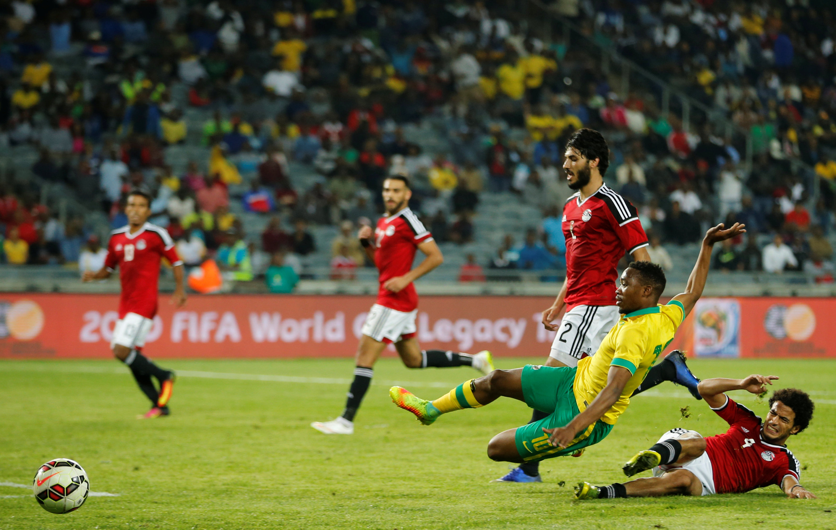 Football Soccer - South Africa v Egypt - Nelson Mandela Challenge soccer match - Orlando Stadium, Soweto, South Africa - 6/9/16 South Africa's Sibusiso Vilakazi (L) is tackled by Egypt's Omar Gaber. REUTERS/Siphiwe Sibeko