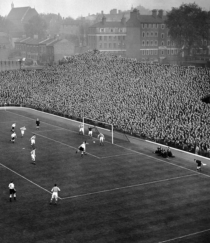 Sport, Football, pic: 1950, An aerial shot shows action from an Arsenal home match at Highbury Stadium, London, showing a packed terrace at the famous 