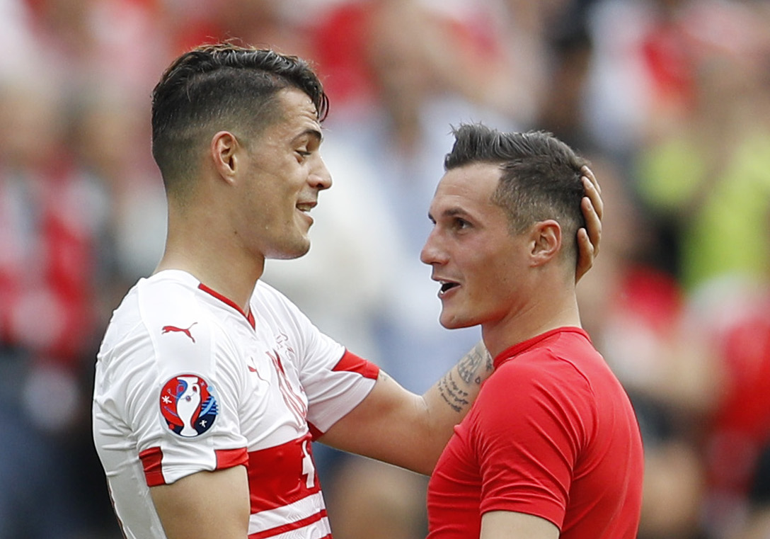 Football Soccer - Albania v Switzerland - EURO 2016 - Group A - Stade Bollaert-Delelis, Lens, France - 11/6/16 Switzerland's Granit Xhaka with his brother Albania's Taulant Xhaka at the end of the game REUTERS/Darren Staples Livepic
