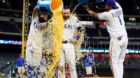 Sep 27, 2016; Arlington, TX, USA; Texas Rangers second baseman Rougned Odor (12) and shortstop Elvis Andrus (1) pour water an