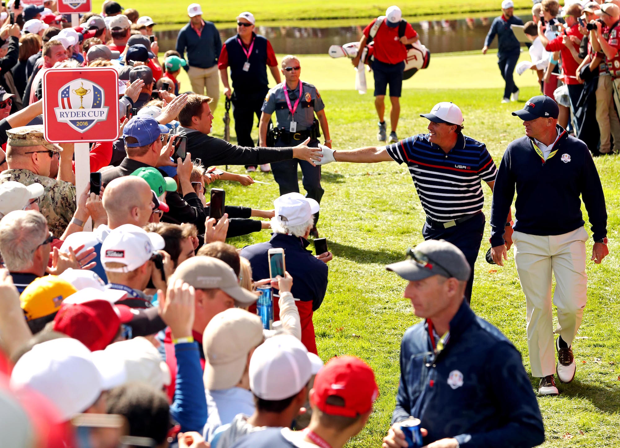 Sep 29, 2016; Chaska, MN, USA; Phil Mickelson of the United States greets fans on the 15th green during a practice round for the 41st Ryder Cup at Hazeltine National Golf Club. Mandatory Credit: Rob Schumacher-USA TODAY Sports